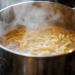 boiling the pasta for cajun shrimp